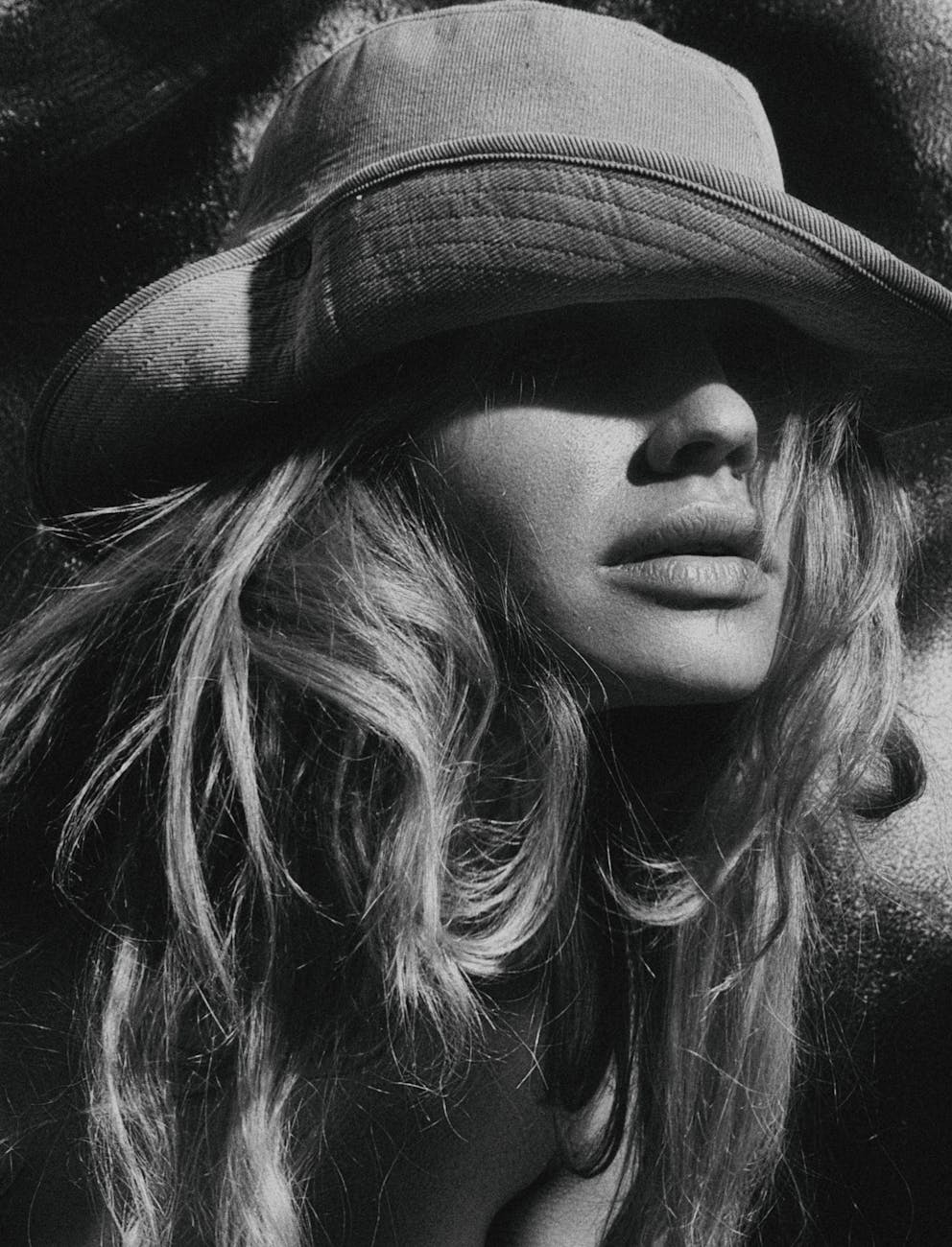 grayscale photography of woman wearing hat