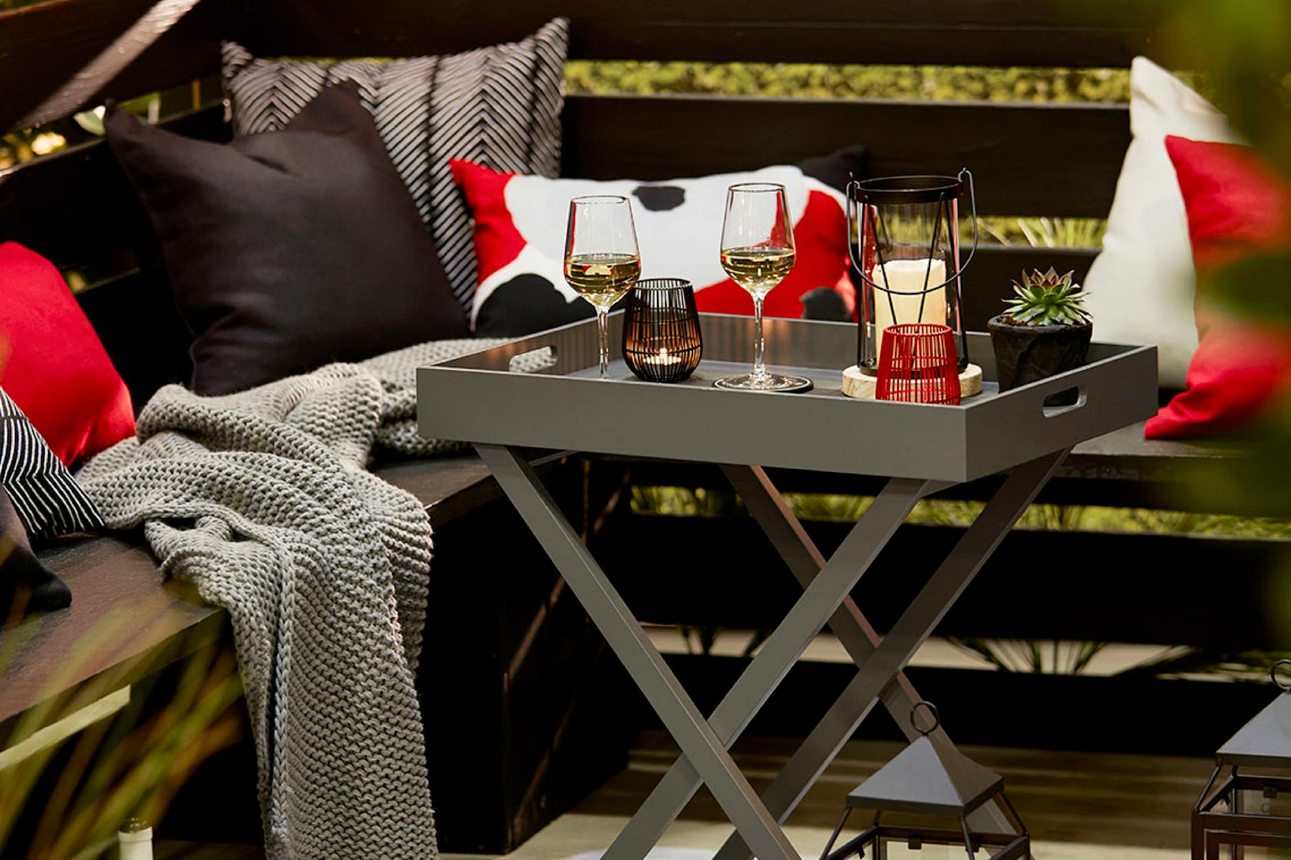 wine glasses on table near pillows