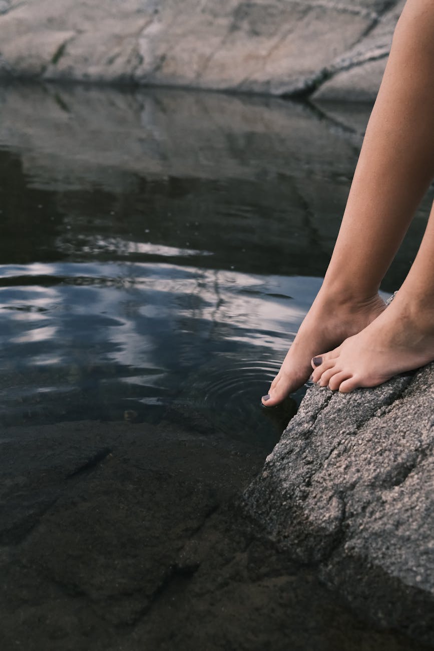 woman legs on rock