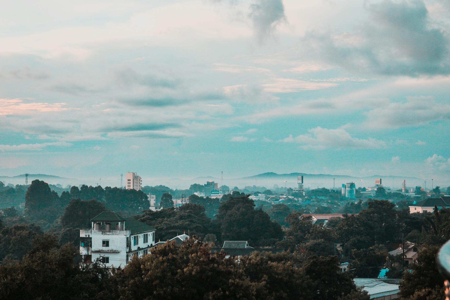 grey cloudy blue sky over city skyline