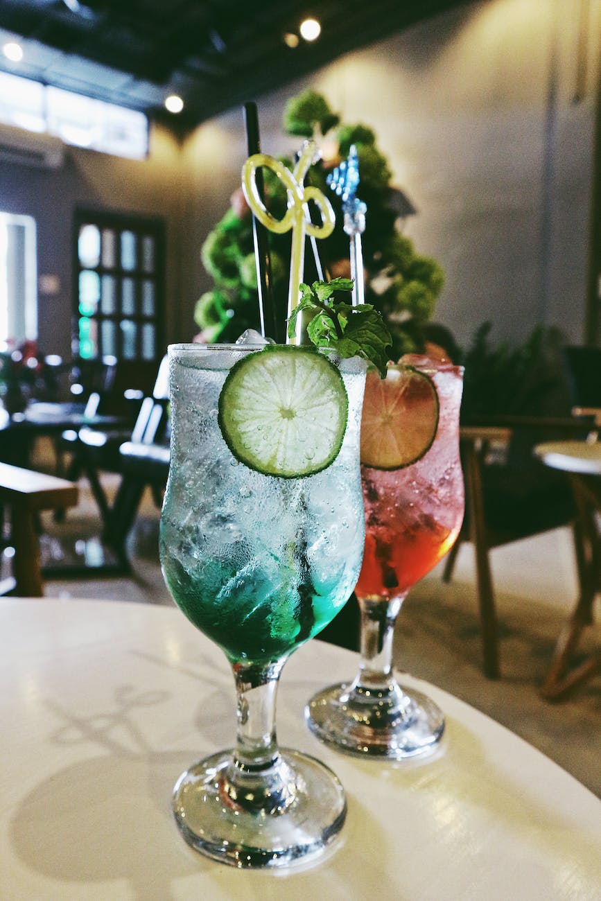 two filled cocktail glasses on table