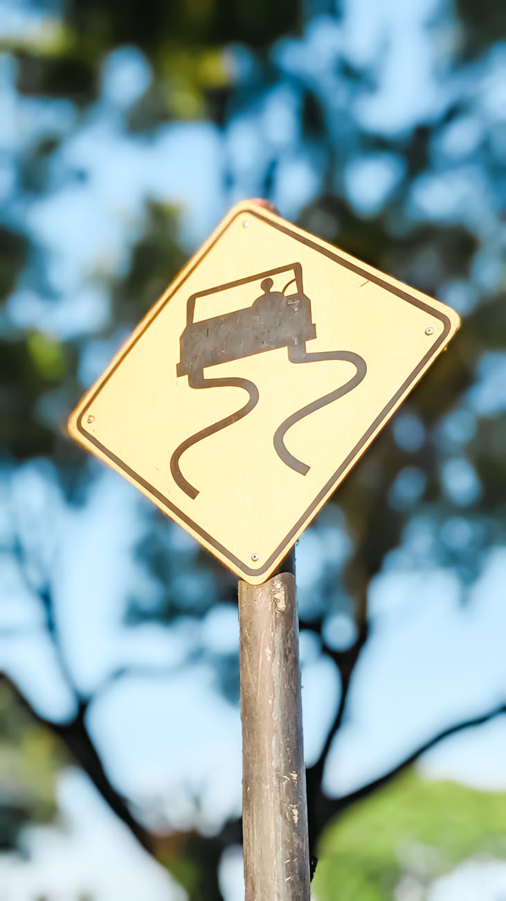 slippery road sign