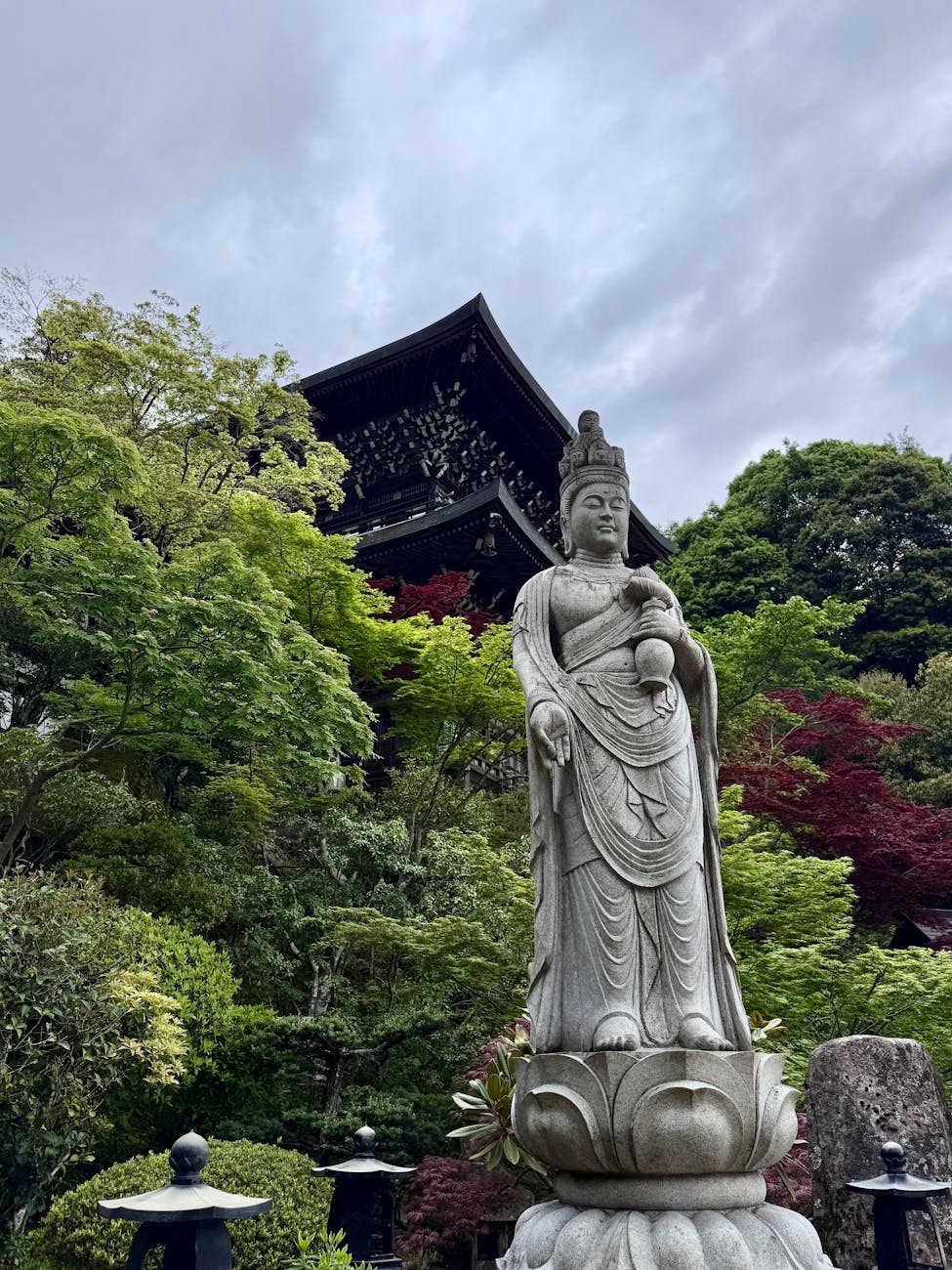 serene buddhist statue in tranquil japanese garden