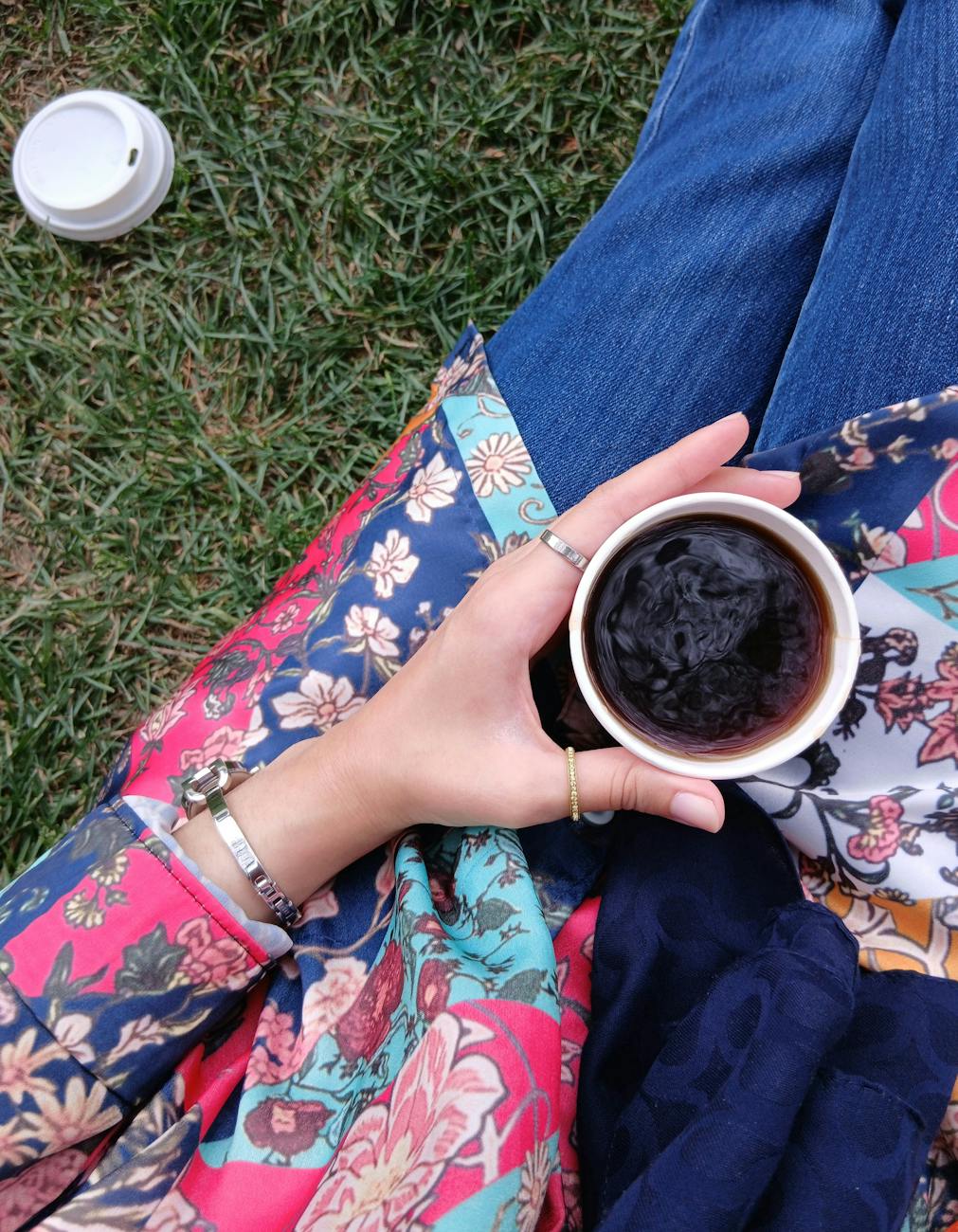 casual outdoor coffee moment in floral outfit