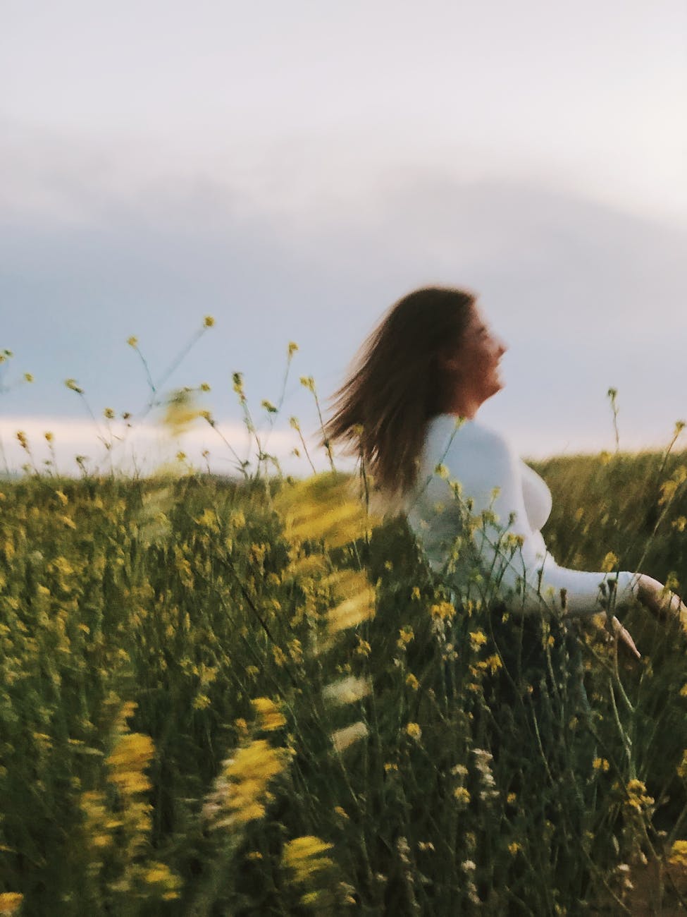 a blur shot on woman in green grass