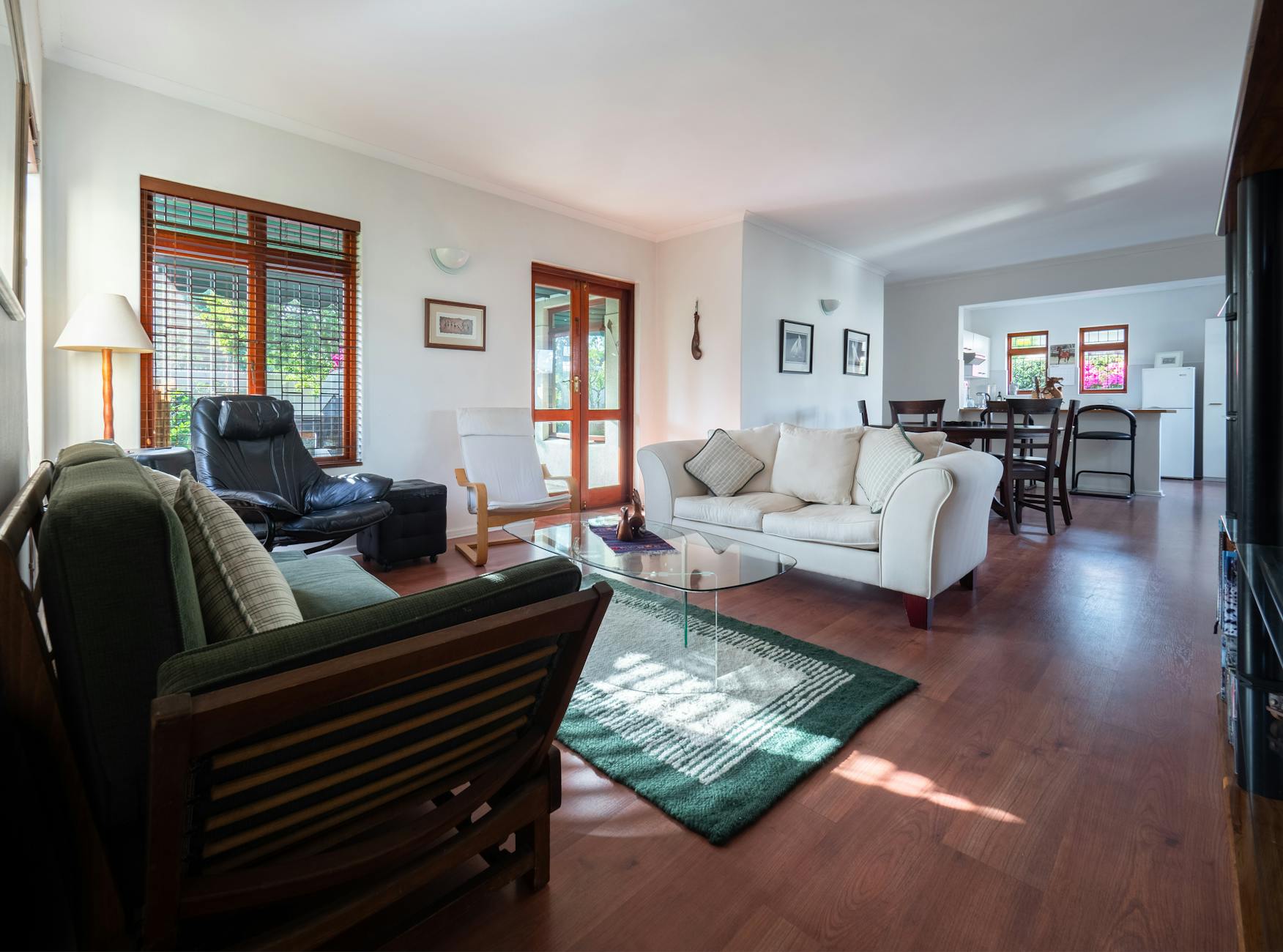 photo of white sofa near glass table