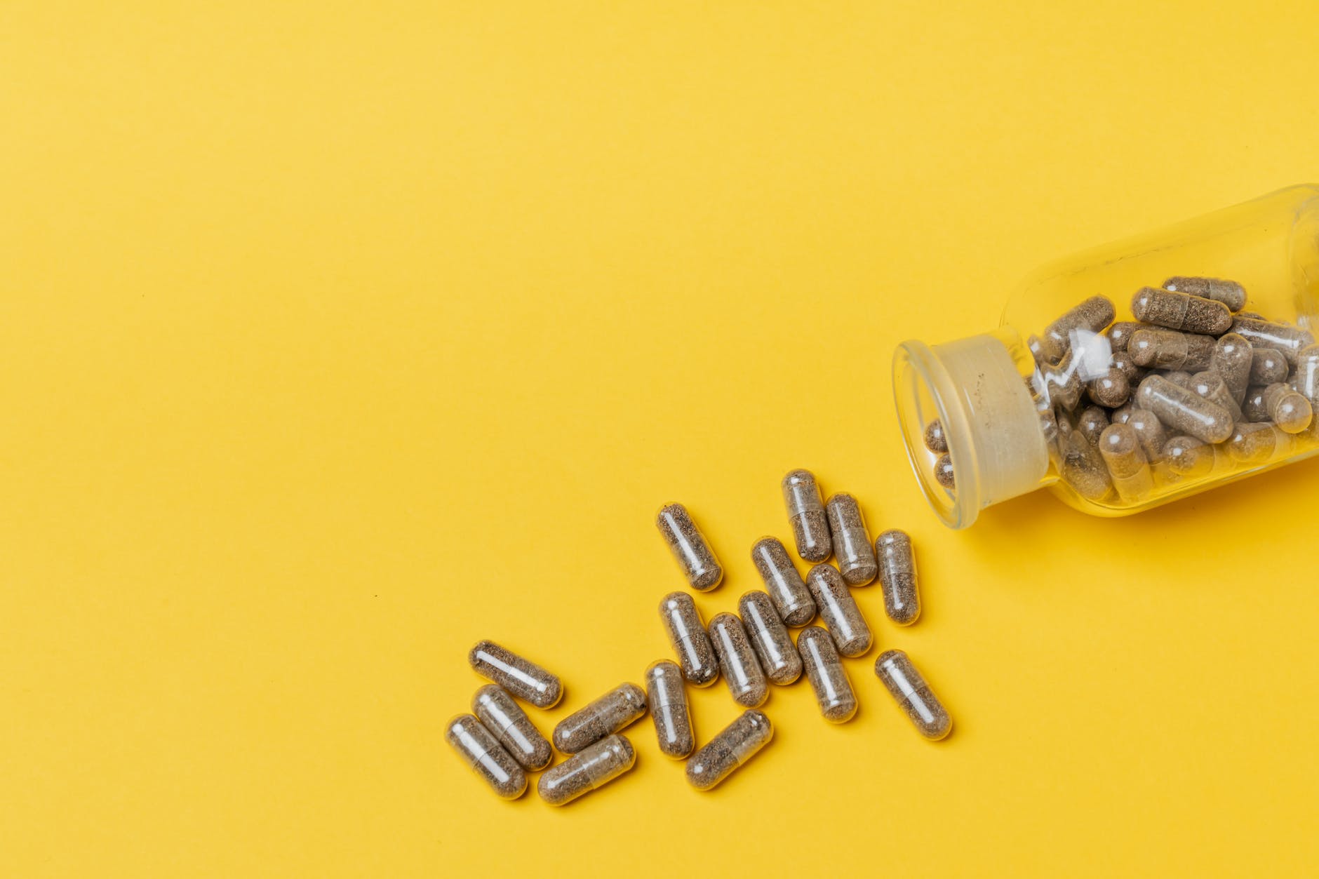 capsules in yellow surface