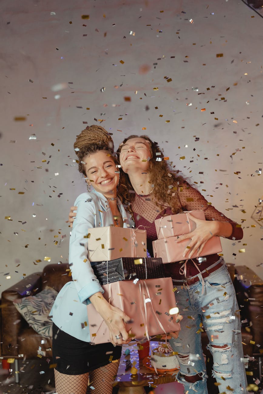 happy women carrying gifts
