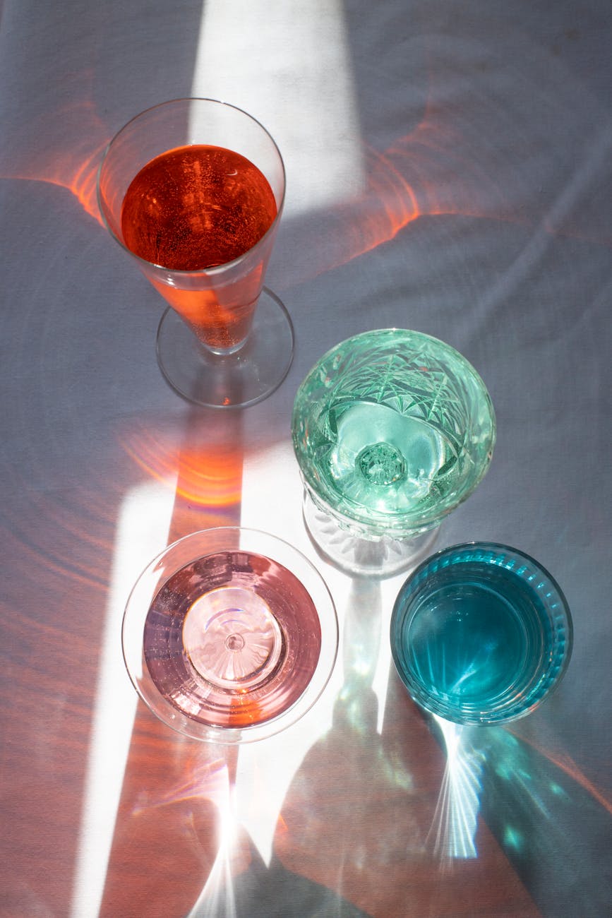 drinks in transparent glasses lightened by sun