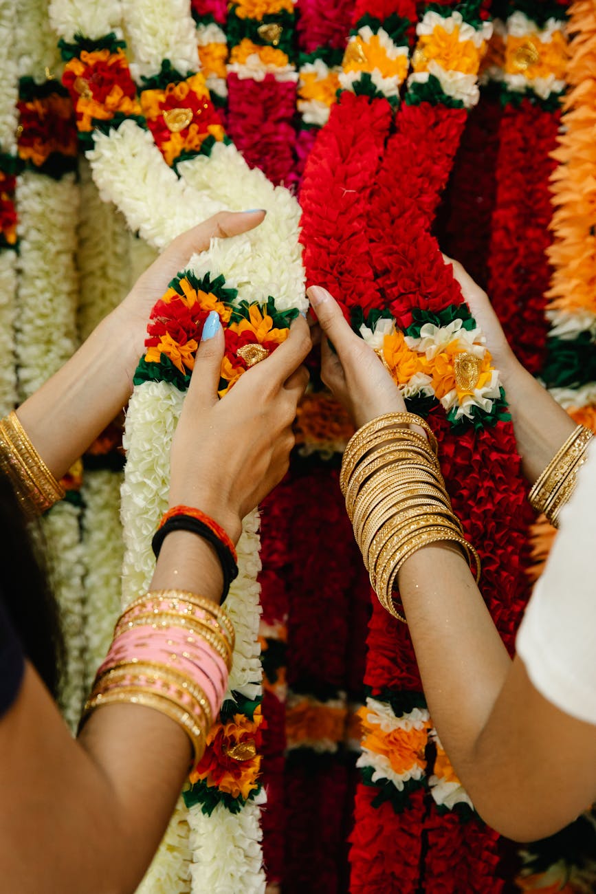 women wearing bracelets touching textile decoration